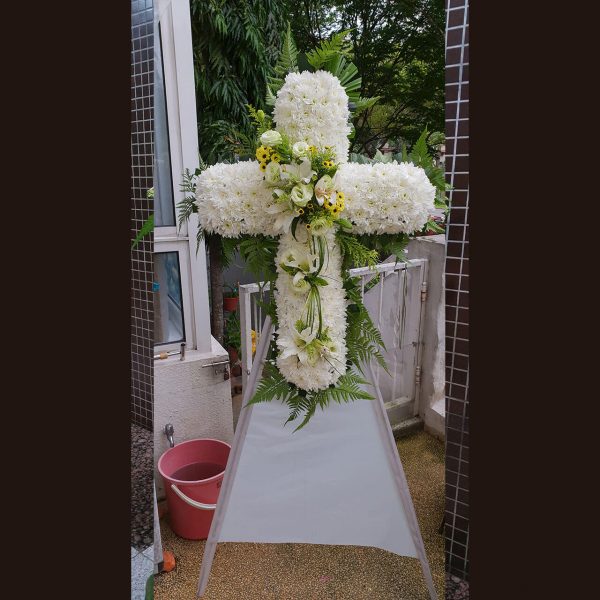 Cross With Lilies & Eutomas In Vertical Cream Tone